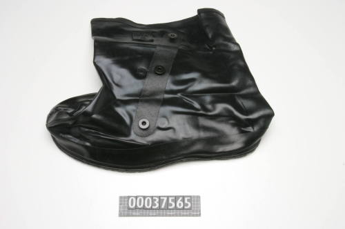 BLACK RUBBER BOOT WITH THREE METAL BUTTONS AND ELASTIC SHOE LACE WORN WITH CHEMICAL SUIT