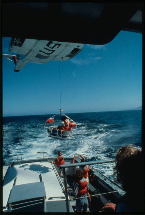 Helicopter rescue basket mid air