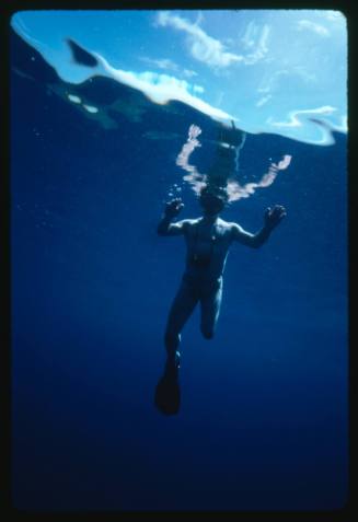 A person in the water with a camera 
