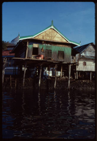Houses on stilts at edge of water in Indonesia