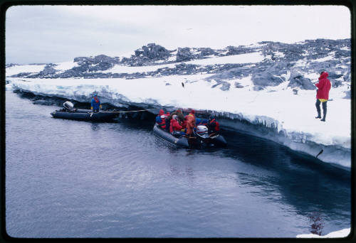 Two inflatable motorboats in water