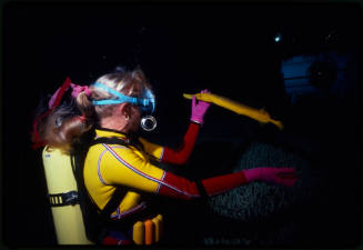 Valerie Taylor holding yellow pipefish