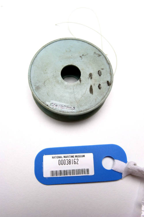 Plastic spool of fishing line with nylon line still attached