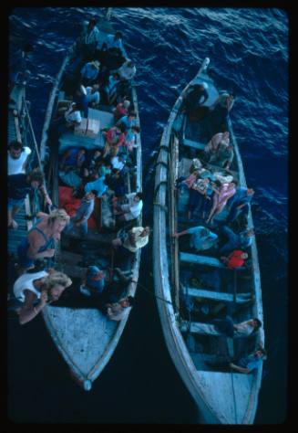 Aerial shot of two wooden boats in the water