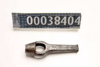 Punch in the shape of a spanner with a ring on the edge used by ship plumber John Carrol