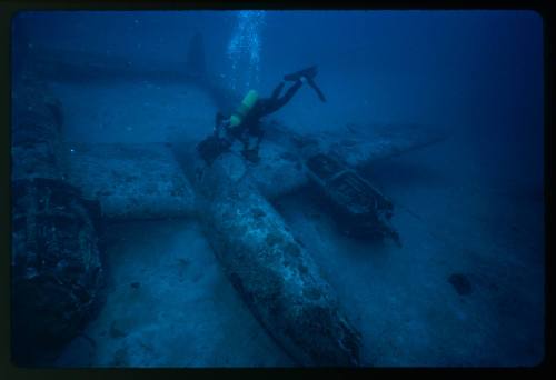 Diver at a aircraft wreck underwater