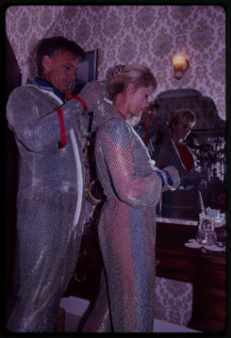 Behind the scenes image from the television feature, Operation Shark Bite, that documented Ron and Valerie Taylor testing the efficacy of the chainmail suit (mesh suit) against shark bites.  