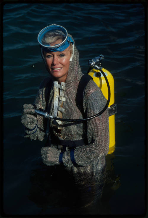 Behind the scenes image from the television feature, Operation Shark Bite, that documented Ron and Valerie Taylor testing the efficacy of the chainmail suit (mesh suit) against shark bites.  