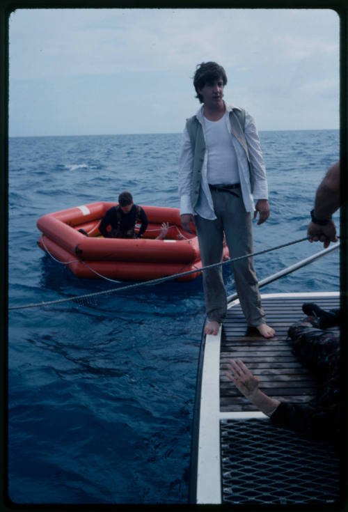 People preparing to shoot a scene with dummy corpses