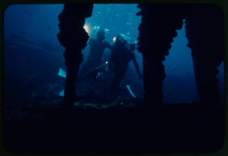 Two divers with underwater cameras