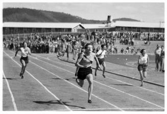 Black and white photo of people running in a foot race