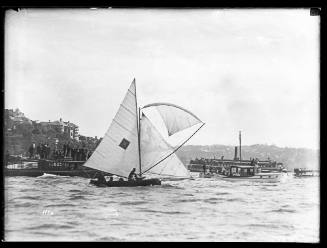 8 or 10-foot skiff and spectator craft sailing near shoreline, Sydney Harbour