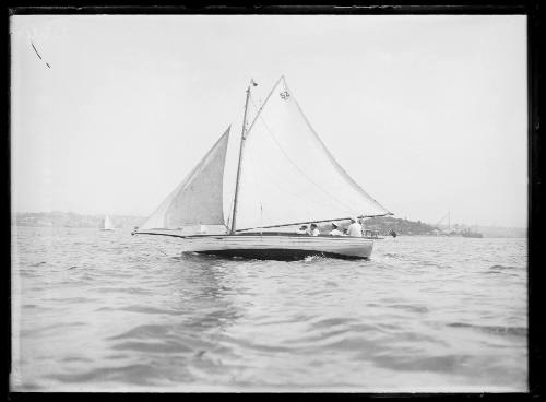 Sailing vessel with the number '52' on the mainsail sailing near Middle Head, Sydney Harbour