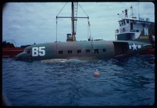 Prop plane being submerged into the ocean for the filming of "Sky Pirates"