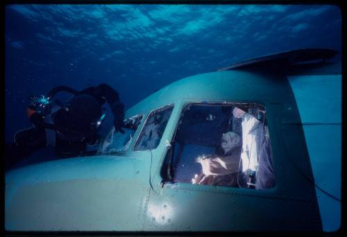 Filming on submerged prop plane for "Sky Pirates"