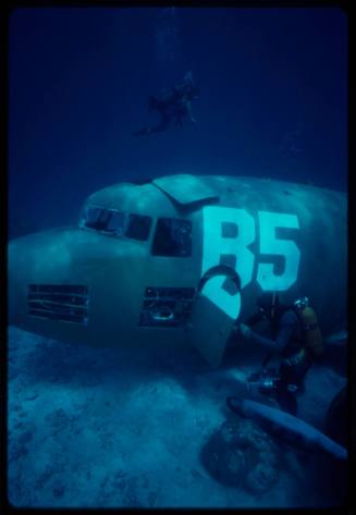 Filming around submerged prop plane for "Sky Pirates"