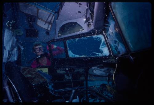 Valerie Taylor exploring the insides of a submerged prop plane from the filming of "Sky Pirates"