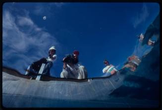 Photograph of a film crew shot from underwater