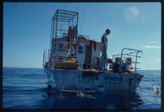 Two men at the back of the Trade Winds during filming for "Jaws"