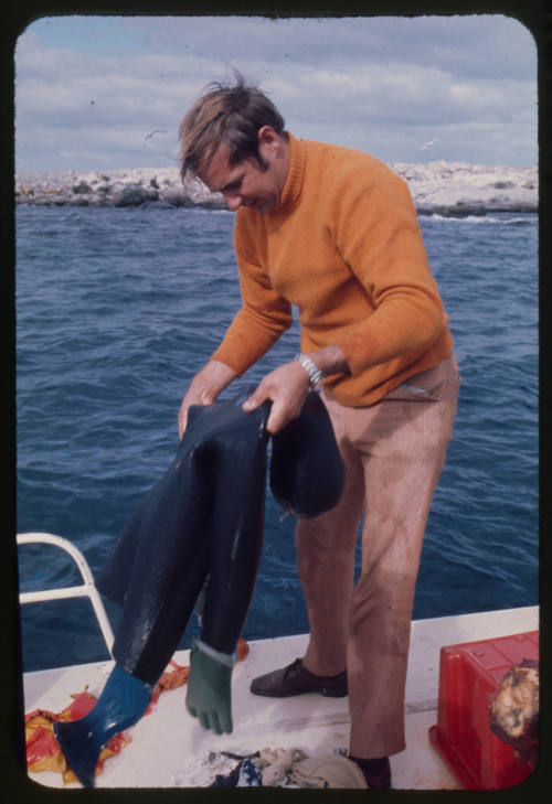 Testing out the chainmail suit (mesh suit) using a dummy in experiments with blue sharks and white sharks (great white sharks) before testing with a human 