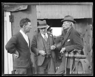 Three men on a sheerlegs crane probably salvaging the wreck of Sydney ferry GREYCLIFFE