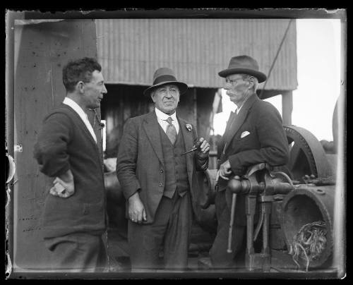 Three men on a sheerlegs crane probably salvaging the wreck of Sydney ferry GREYCLIFFE