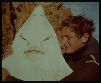 Close up shot of person holding the head of a Skate (fish)