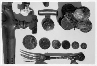 Fork, coins and buckle from the wreck of the DUNBAR