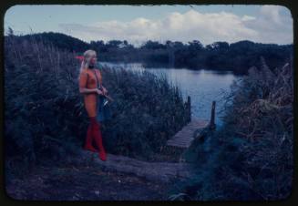 Valerie Taylor standing next to a pond