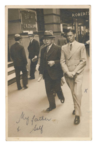 Two men walking down the street possibly Dudley Charles Northam and his father