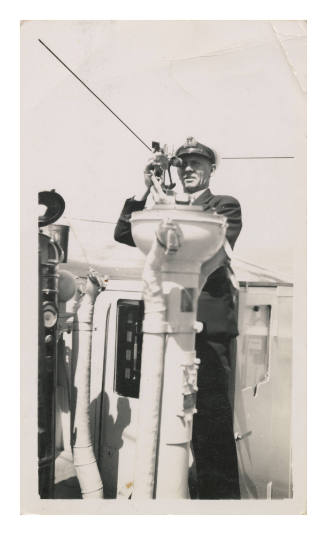 Dudley Charles Northam with binoculars at one eye