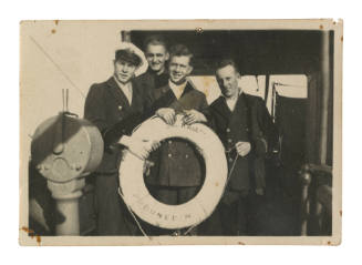 Four men holding lifebuoy