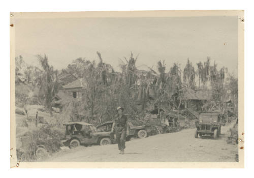 Man walking down dirt road