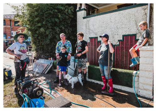 Group of adults and children prepared for clean up