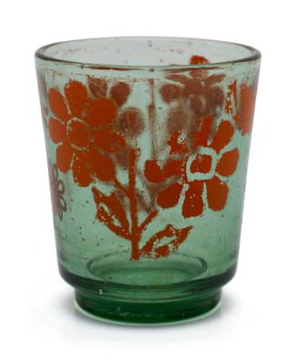 Drinking glass with orange flowers, similar to those used on TU DO