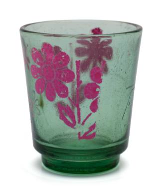 Drinking glass with pink flowers, similar to those used on TU DO