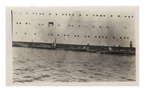 Boats alongside a ship