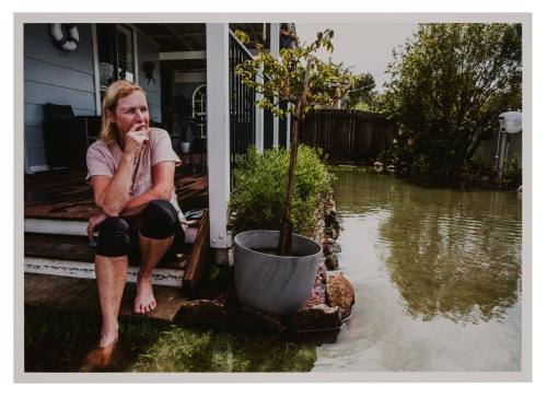 Person looking at flooded garden