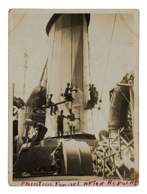 Painting the funnel of HMAS SYDNEY II