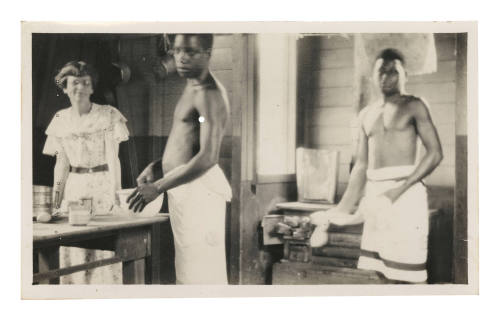 Three people in a kitchen