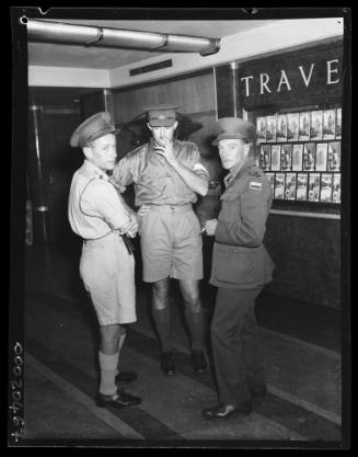 Military personnel standing in the corridor of RMS QUEEN MARY