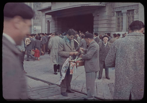 Man purchasing from street vendor on wharf