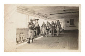 People dressed up on deck of MAUNGANUI