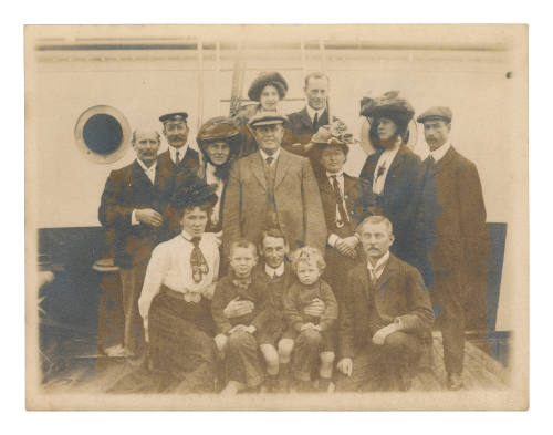 Group photograph taken on the deck of a vessel