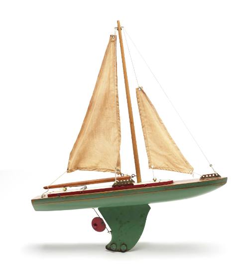 Toy yacht with green hull