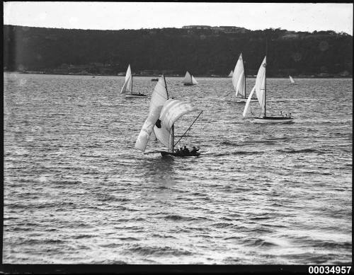 Seven cutter rigs racing in harbour.