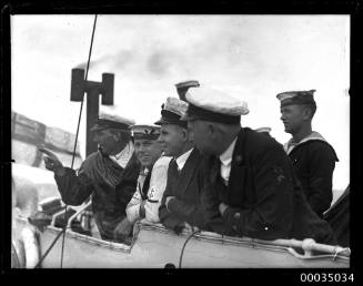 Naval officers and sailors of HMAS ANZAC watching the sinking of HMAS TORRENS I