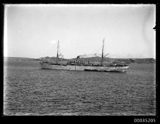 Cargo ship at anchor in harbour