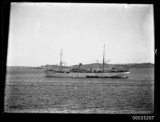 Cargo ship at anchor in harbour