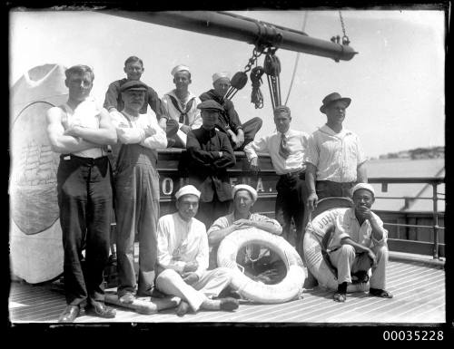 Crew posing on board the four-masted steel barque JOHN ENA